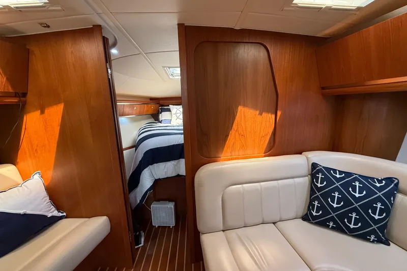 Slide: The Image of Luxurious interior of 2004 Tiara Yachts 3600 Sovran with wood paneling and nautical decor. - 52