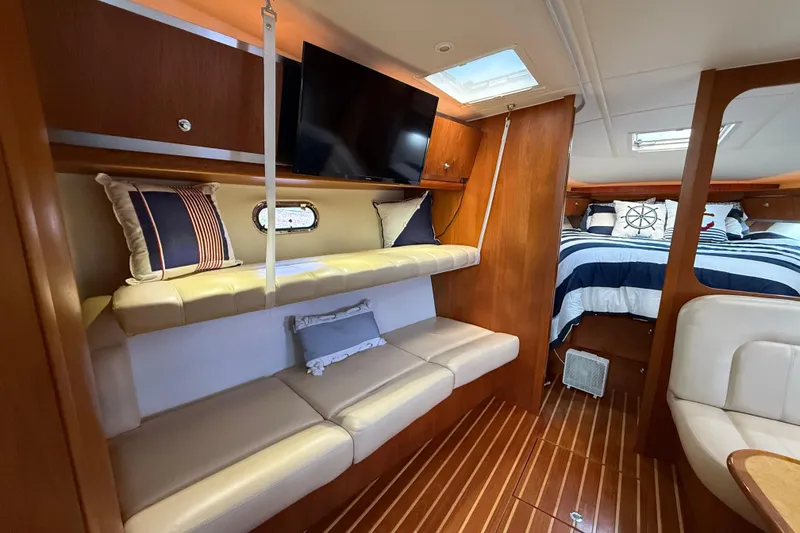Slide: The Image of Luxurious interior of 2004 Tiara Yachts 3600 Sovran with cozy seating and stylish decor. - 53