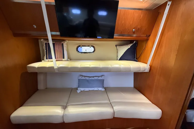 Slide: The Image of Interior of 2004 Tiara Yachts 3600 Sovran with cozy seating and TV. - 54
