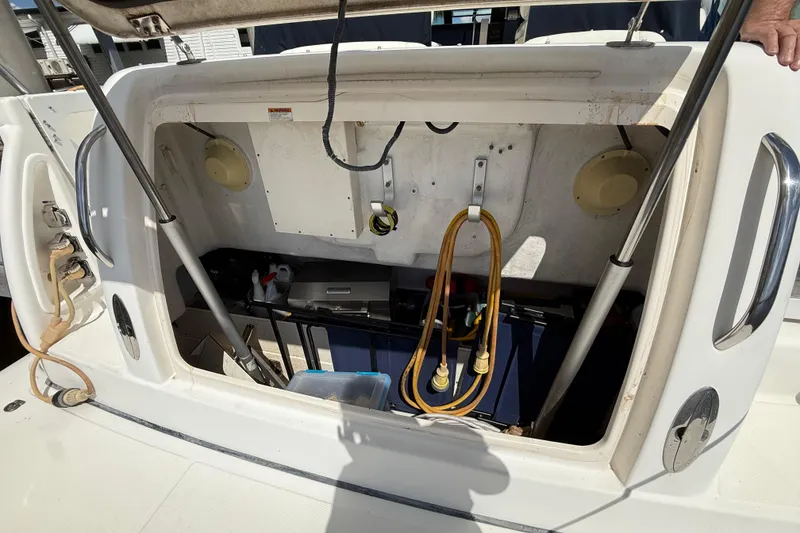 Slide: The Image of 2004 Tiara Yachts 3600 Sovran storage compartment with cables and equipment. - 6