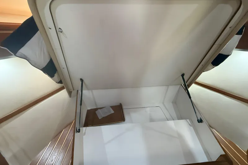 Slide: The Image of Interior storage compartment of 2004 Tiara Yachts 3600 Sovran, open with hydraulic supports. - 61