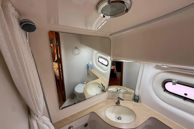 Slide: The Image of Bathroom interior of 2004 Tiara Yachts 3600 Sovran with mirror and sink. - 64