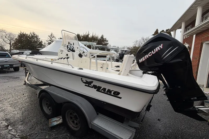 Slide: The Image of 2007 Mako 2201 Tunnel Inshore boat on trailer with Mercury outboard motor. - 3