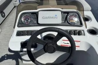 Slide: The Image of 2021 Godfrey Sweetwater 2286 C boat dashboard with Garmin navigation system. - 6