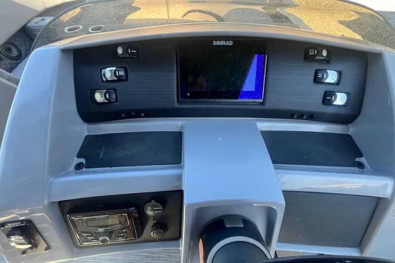 Slide: The Image of Dashboard of 2022 Bennington 23LT boat with Simrad display and controls. - 13