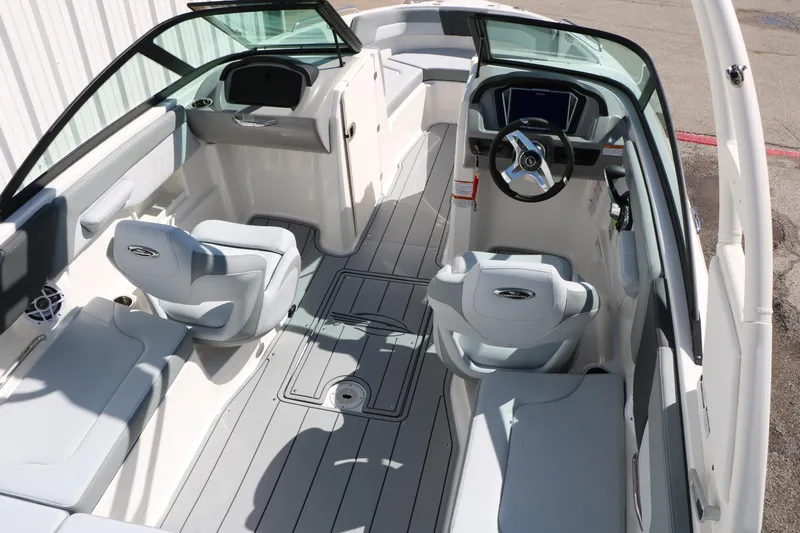 Slide: The Image of 2026 Chaparral 23 SSi boat interior with modern seating and steering wheel. - 17