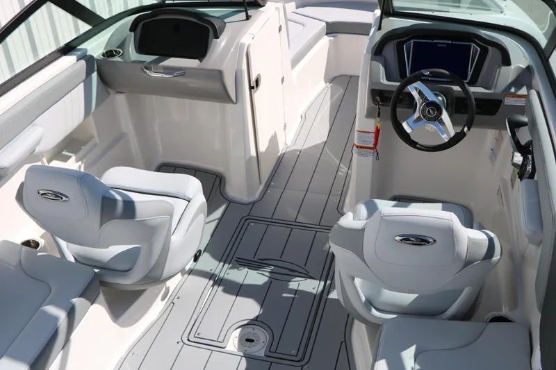 Slide: The Image of 2026 Chaparral 23 SSi boat interior with modern steering and seating design. - 18