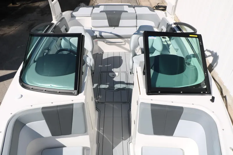 Slide: The Image of 2026 Chaparral 23 SSi boat interior with sleek seating and modern design. - 21