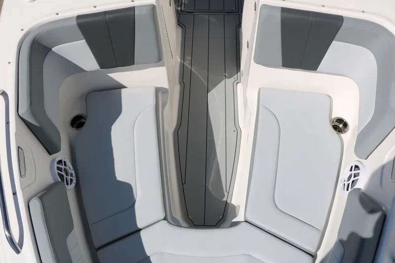 Slide: The Image of Interior view of 2026 Chaparral 23 SSi boat, featuring sleek gray seating and modern design. - 22