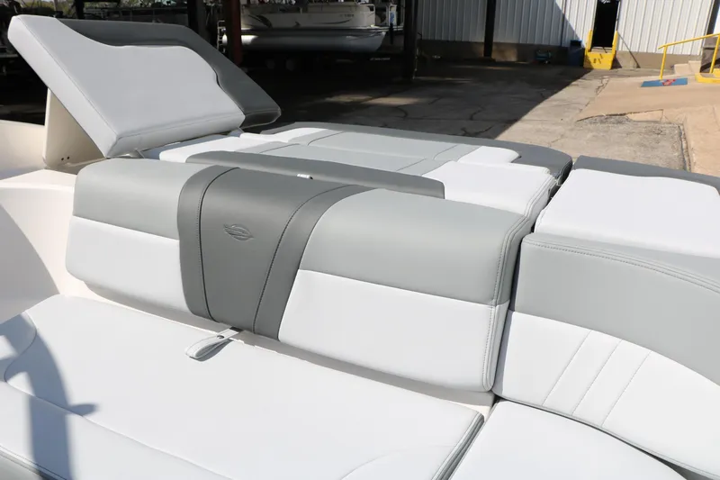 Slide: The Image of 2026 Chaparral 23 SSi boat interior with sleek gray and white seating design. - 25