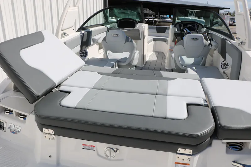 Slide: The Image of 2026 Chaparral 23 SSi boat interior with gray and white seating, showcasing modern design. - 29