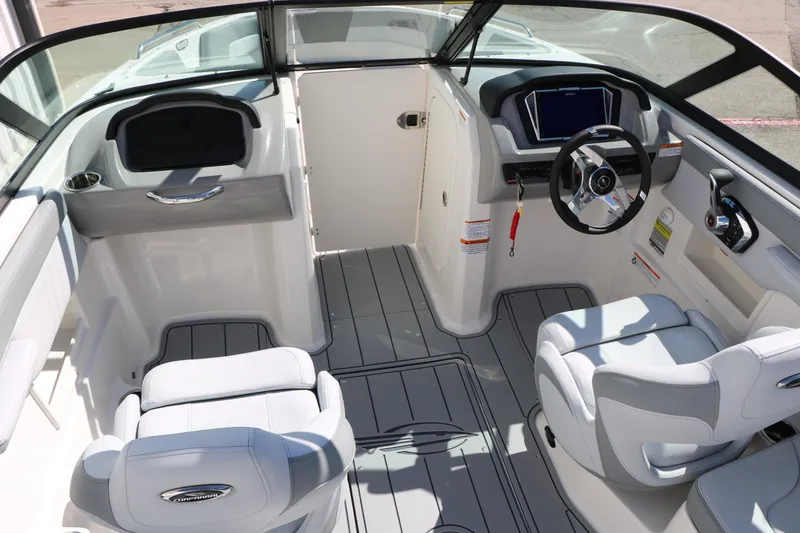 Slide: The Image of 2026 Chaparral 23 SSi boat interior with modern dashboard and seating. - 30
