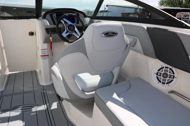 Slide: The Image of 2026 Chaparral 23 SSi boat interior with steering wheel and seating. - 33