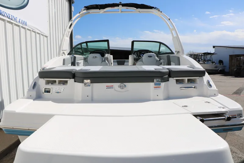 Slide: The Image of 2026 Chaparral 23 SSi boat rear view with seating and swim platform. - 9