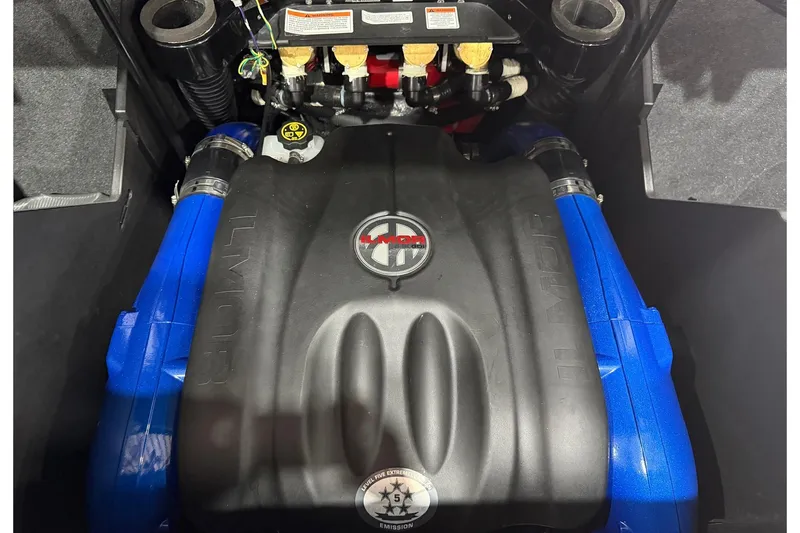 Slide: The Image of Engine of 2022 MasterCraft X26 boat with Ilmor branding and blue components. - 14
