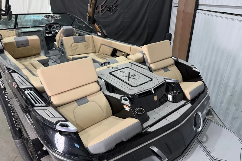 Slide: The Image of 2022 MasterCraft X26 boat interior with beige seating and modern design. - 4