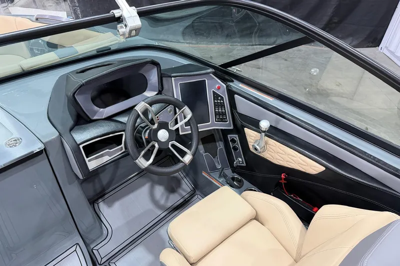 Slide: The Image of 2022 MasterCraft X26 boat interior with modern steering and control panel. - 8