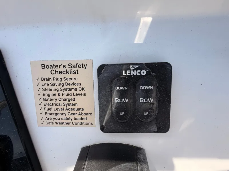 Slide: The Image of Safety checklist and Lenco controls on a BlackJack 224 boat. - 12