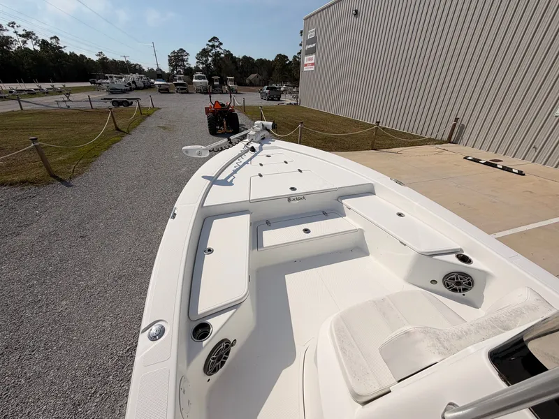 Slide: The Image of 2019 BlackJack 224 boat parked on gravel lot. - 13