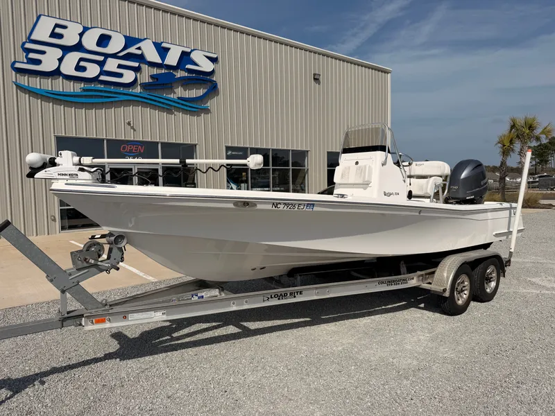 Slide: The Image of 2019 BlackJack 224 boat on trailer outside Boats 365 store. - 2