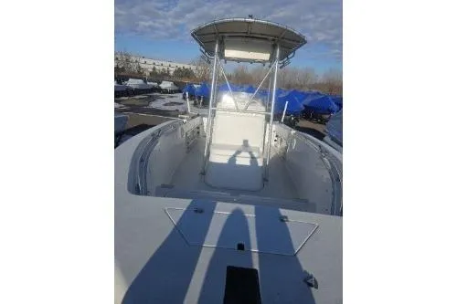 Slide: The Image of 2004 Sea Pro 220 Center Console boat with T-top, docked outdoors. - 6