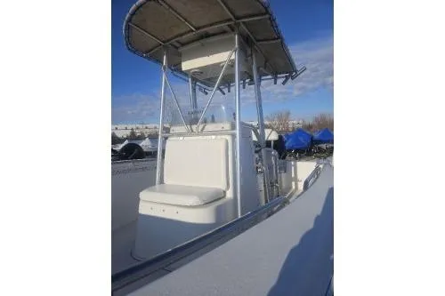 Slide: The Image of 2004 Sea Pro 220 Center Console boat with T-top under clear blue sky. - 8