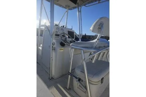 Slide: The Image of 2004 Sea Pro 220 Center Console boat interior with steering wheel and seating. - 9