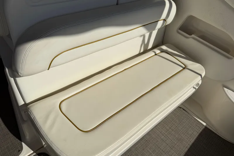 Slide: The Image of White leather seating on a 2003 Sea Ray 300 Sundancer boat. - 15