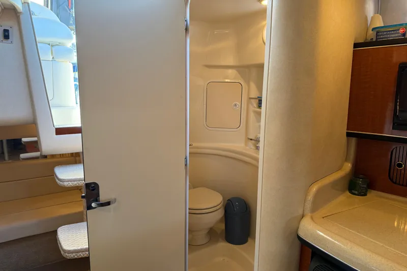 Slide: The Image of Interior of 2003 Sea Ray 300 Sundancer showing bathroom and cabin area. - 22