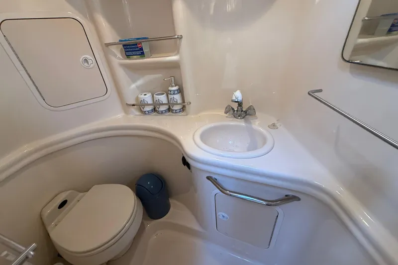 Slide: The Image of Bathroom interior of 2003 Sea Ray 300 Sundancer yacht with sink and toilet. - 40