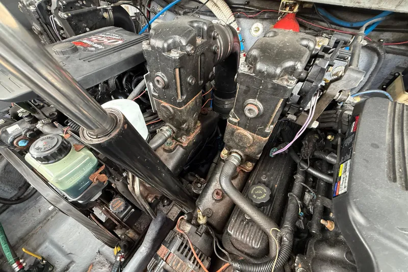 Slide: The Image of Engine compartment of a 2003 Sea Ray 300 Sundancer boat, showing mechanical components. - 43