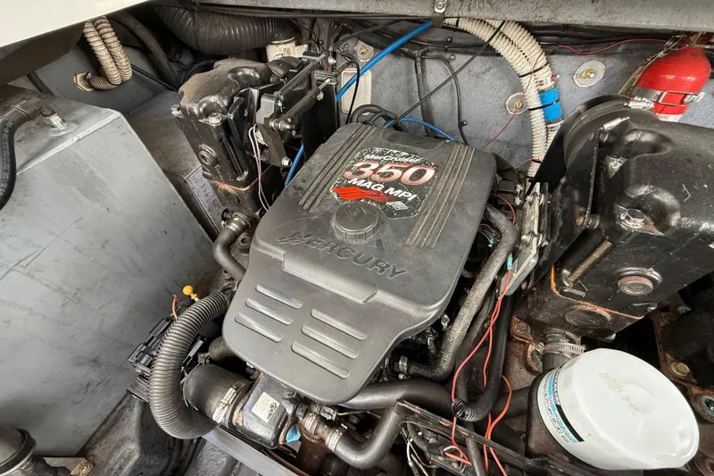 Slide: The Image of Engine compartment of a 2003 Sea Ray 300 Sundancer with Mercury 350 MAG MPI engine. - 44