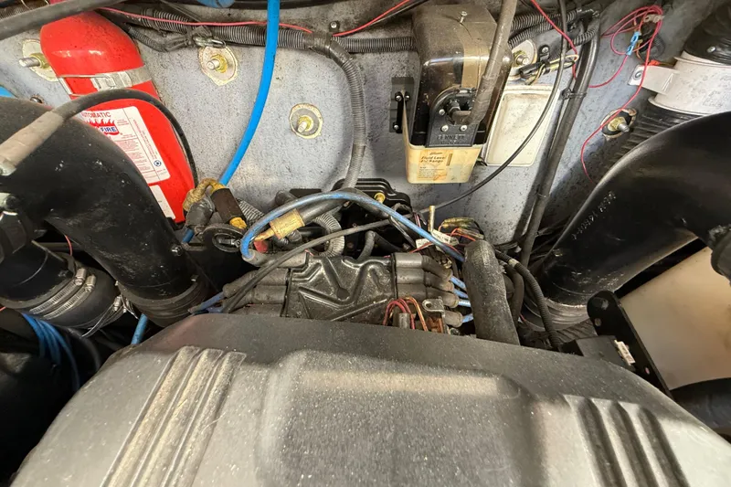 Slide: The Image of Engine compartment of a 2003 Sea Ray 300 Sundancer boat, showing wiring and components. - 47