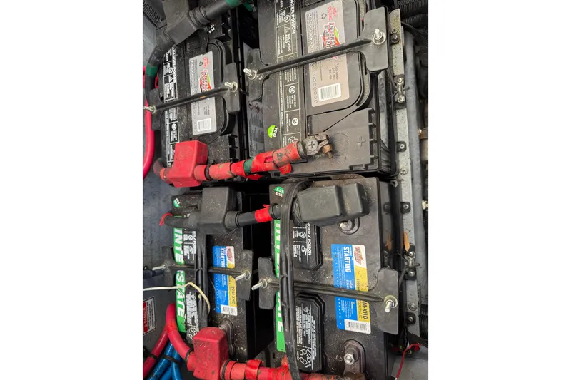 Slide: The Image of Batteries in a 2003 Sea Ray 300 Sundancer boat engine compartment. - 56