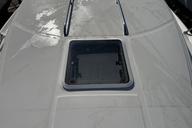 Slide: The Image of 2003 Sea Ray 300 Sundancer deck with hatch and railing. - 6