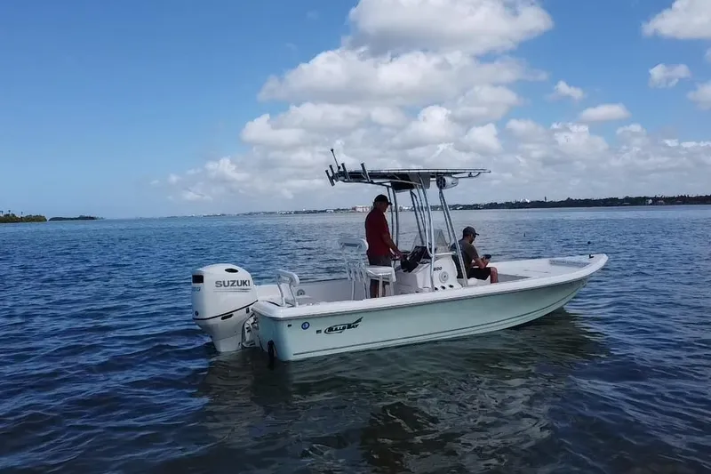 Slide: The Image of 2021 Bulls Bay 2200 boat on calm water with Suzuki outboard motor. - 19