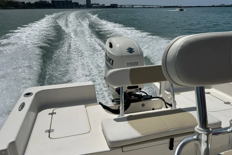 Slide: The Image of 2021 Bulls Bay 2200 boat with Suzuki 150 engine cruising on open water. - 20