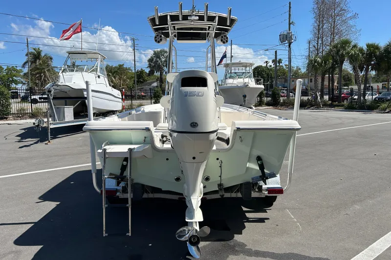 Slide: The Image of 2021 Bulls Bay 2200 boat with outboard motor in a marina setting. - 3