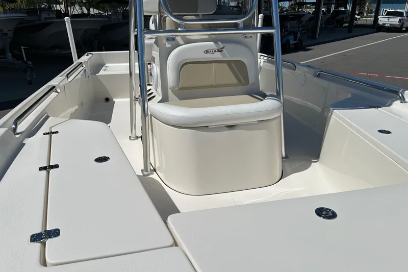 Slide: The Image of 2021 Bulls Bay 2200 boat interior with seating and storage compartments. - 9