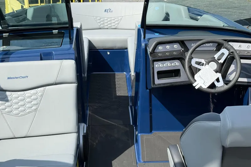 Slide: The Image of Interior of 2026 MasterCraft NXT24 boat with modern dashboard and seating. - 5
