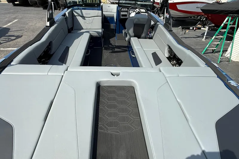 Slide: The Image of 2026 MasterCraft NXT24 boat interior with spacious seating and modern design. - 8