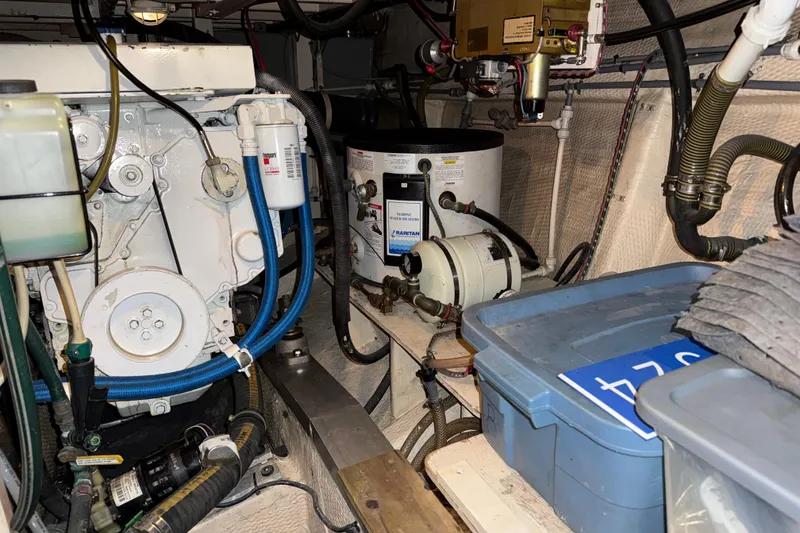 Slide: The Image of Engine room of 1991 Grand Banks 42 Classic with mechanical components and storage. - 109