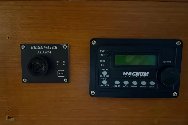 Slide: The Image of Bilge water alarm and Magnum Energy control panel on 1991 Grand Banks 42 Classic yacht. - 45