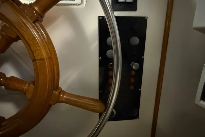 Slide: The Image of Wooden helm and control panel of 1991 Grand Banks 42 Classic yacht. - 96
