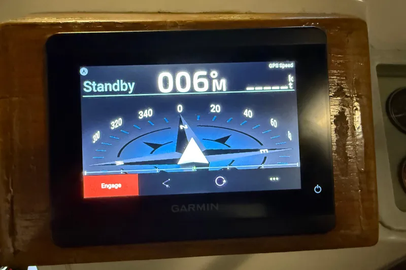 Slide: The Image of Garmin navigation display on 1991 Grand Banks 42 Classic, showing compass and standby mode. - 98