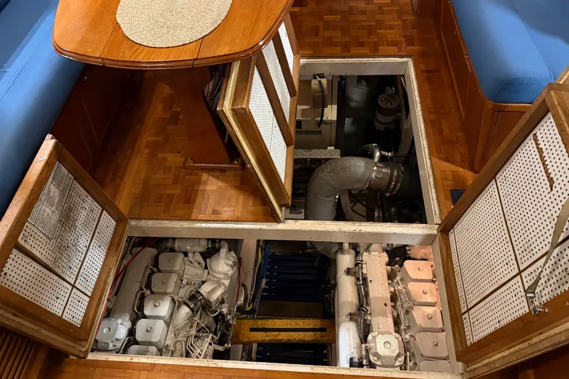 Slide: The Image of Engine room of a 1991 Grand Banks 42 Classic yacht, showcasing dual engines. - 120