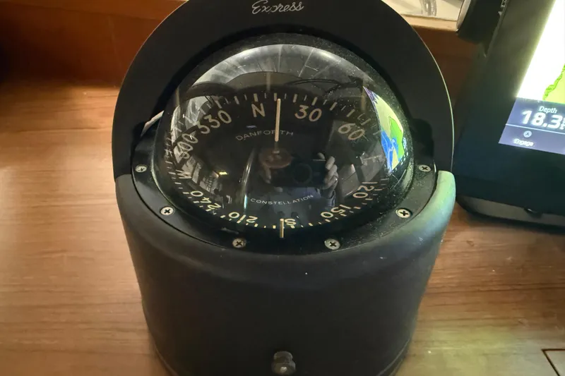 Slide: The Image of Compass on 1991 Grand Banks 42 Classic yacht, showing navigation details. - 38
