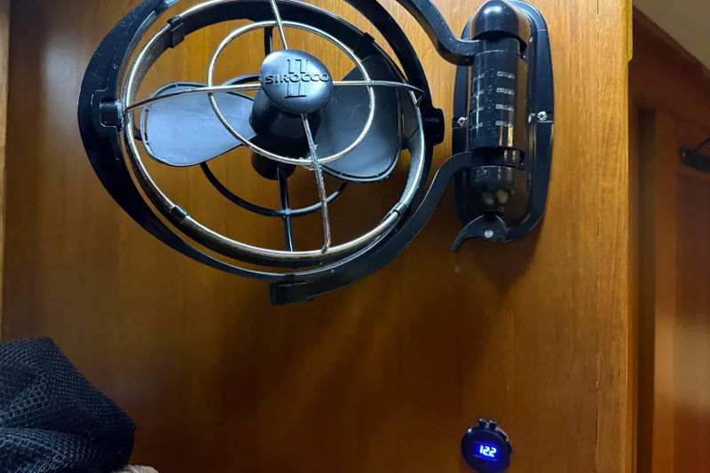 Slide: The Image of Wall-mounted fan inside 1991 Grand Banks 42 Classic boat cabin. - 59