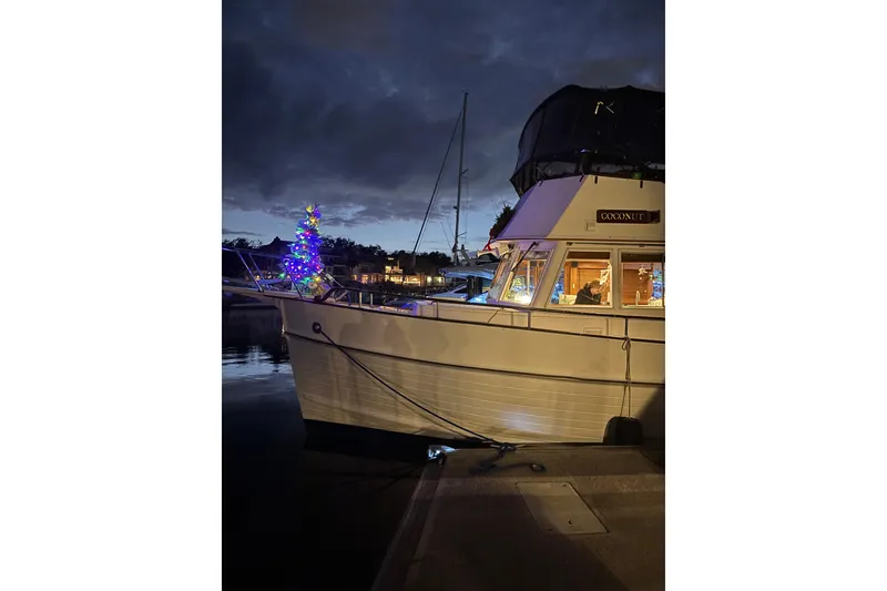 Slide: The Image of Grand Banks 42 Classic yacht, 1991, decorated with Christmas lights at night. - 132
