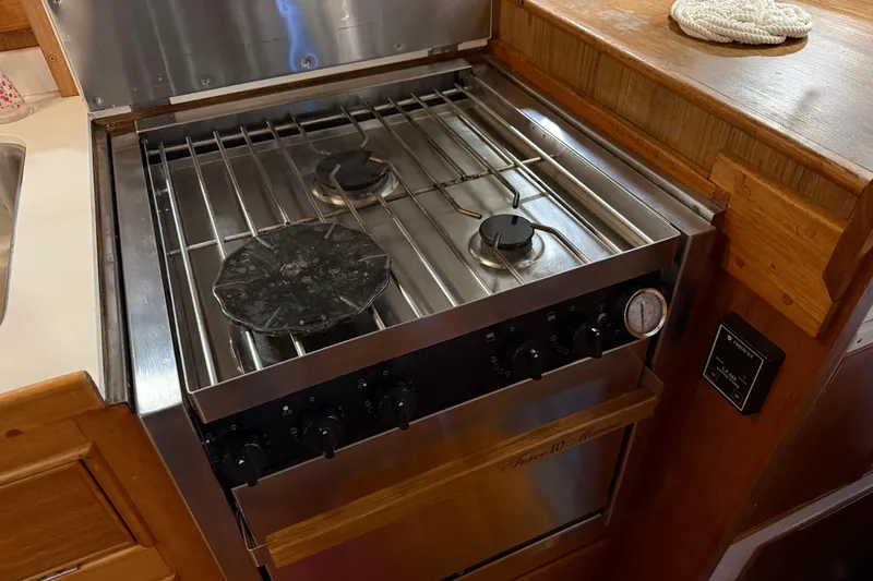Slide: The Image of Stainless steel stove in 1991 Grand Banks 42 Classic yacht kitchen. - 29